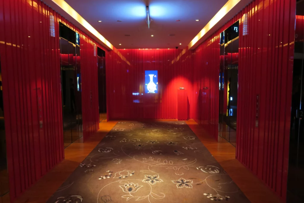 a hallway with red curtains