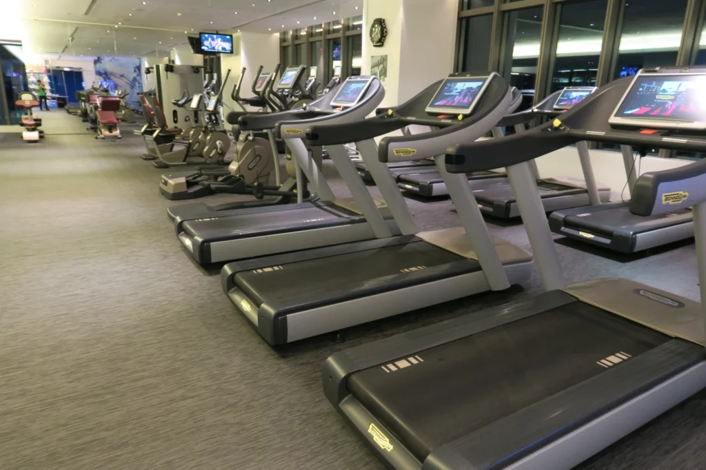 a group of treadmills in a gym