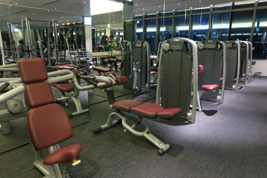 a gym with many exercise equipment