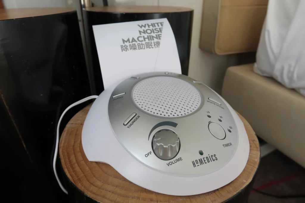 a white and silver device on a wood surface