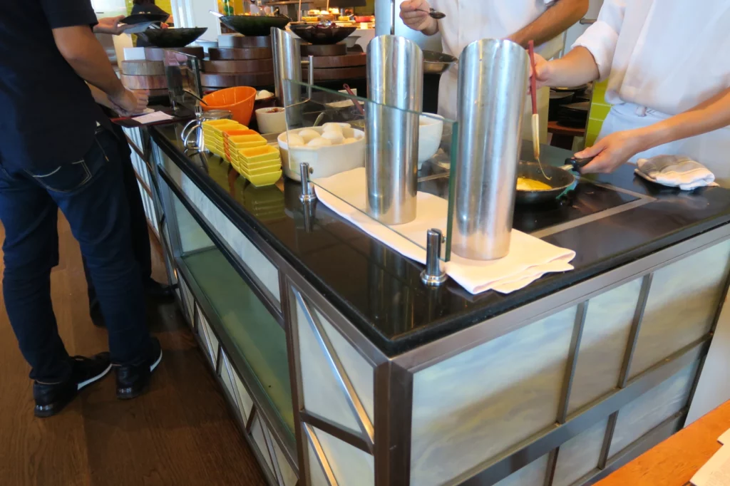 a group of people cooking in a restaurant