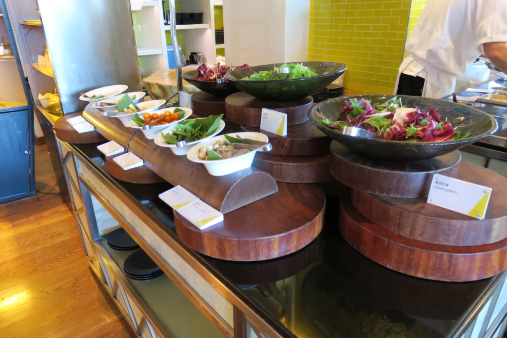 a buffet table with bowls of food