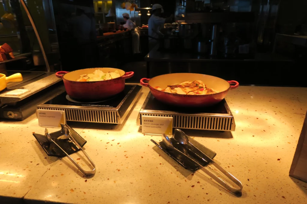 a couple of bowls of food on a counter