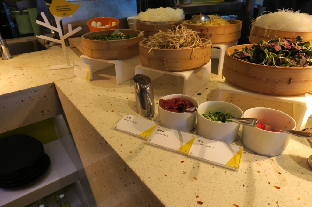 a counter with bowls of food