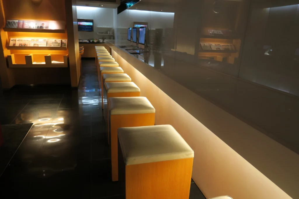 a row of stools in a restaurant