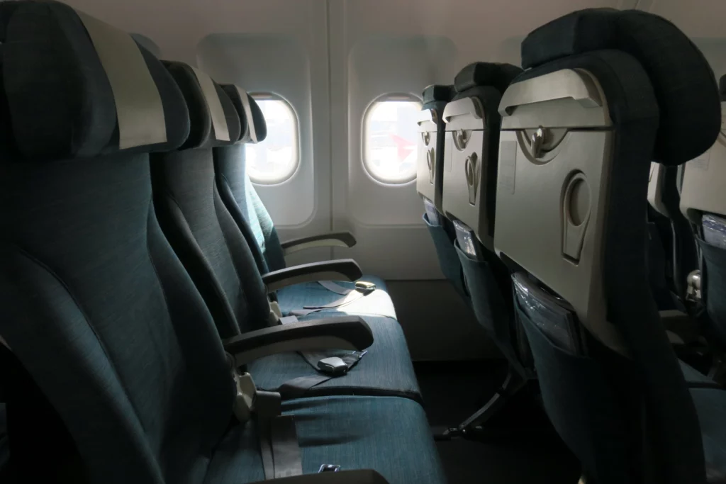 seats in an airplane with windows