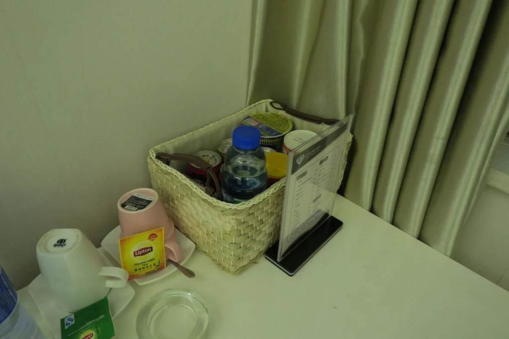 a basket with food and drinks on a table