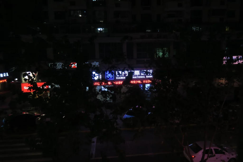 a building with neon signs at night