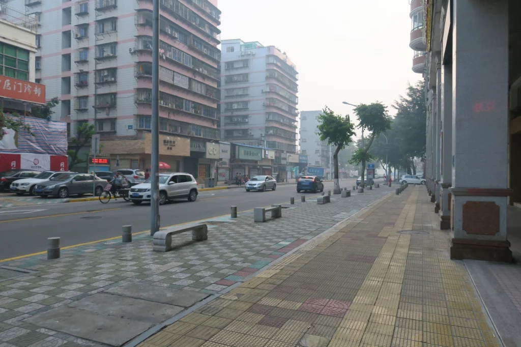 a street with cars and buildings