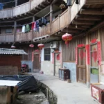 a circular building with red lanterns from the outside