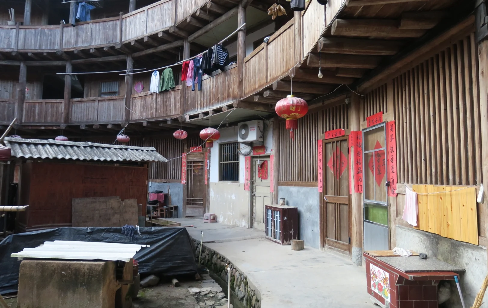 a circular building with red lanterns from the outside
