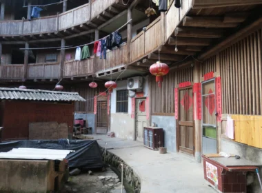 a circular building with red lanterns from the outside