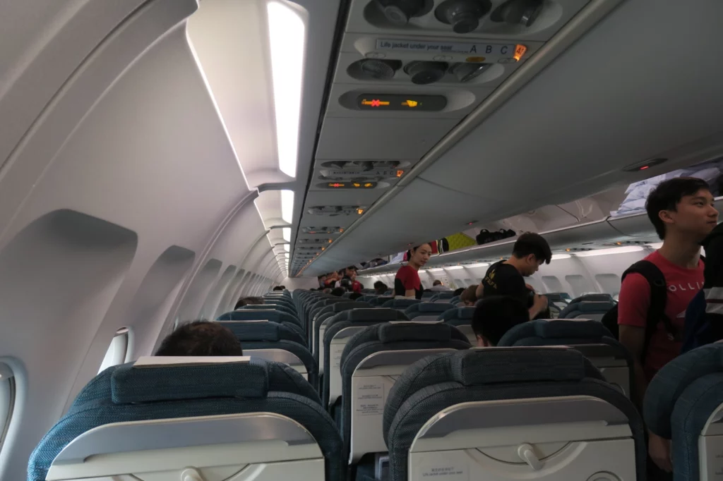 a group of people sitting on an airplane