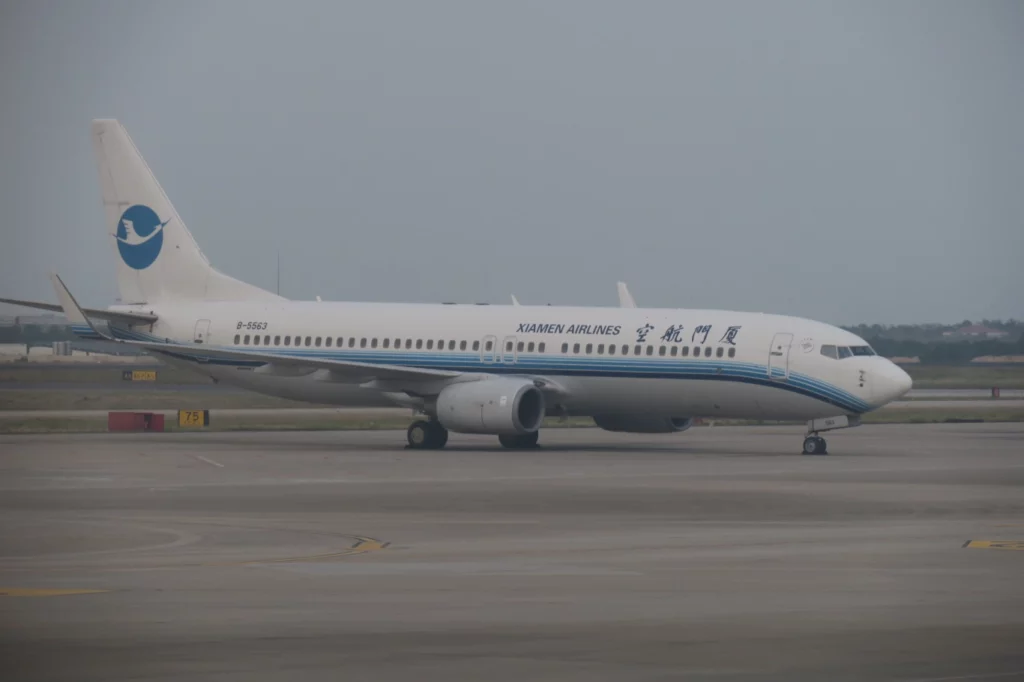 a white airplane on a runway