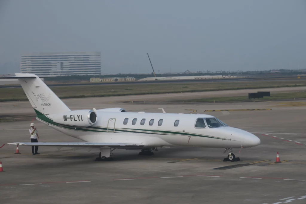 a white airplane on a runway