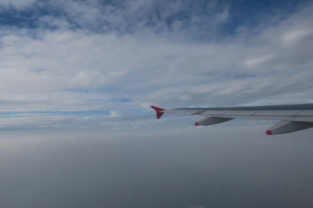 an airplane wing in the sky