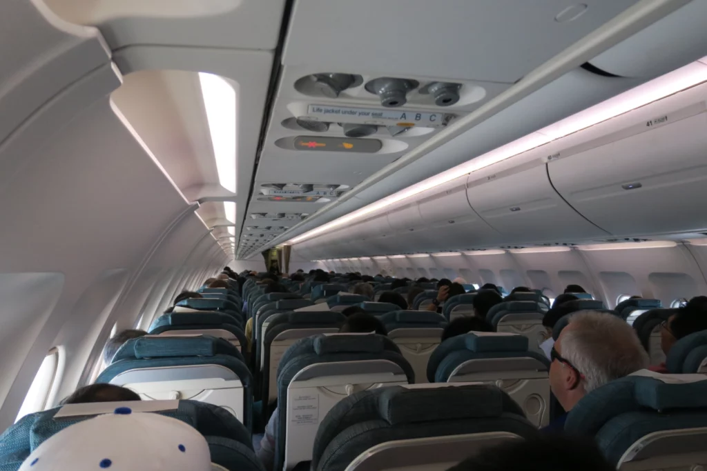 a group of people sitting in an airplane