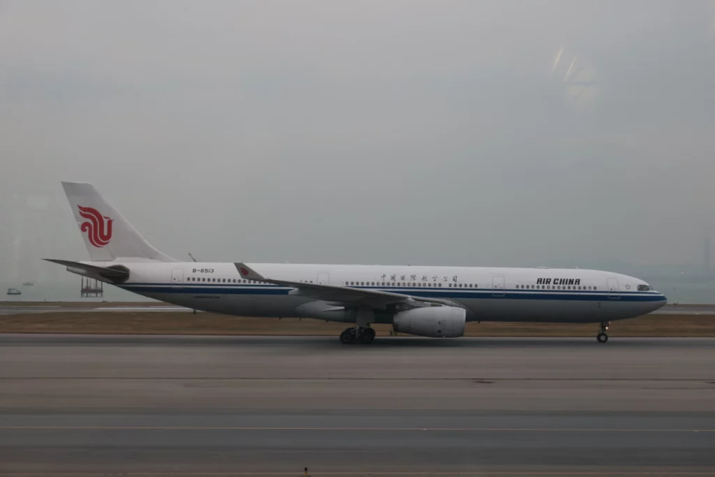 a white airplane on a runway