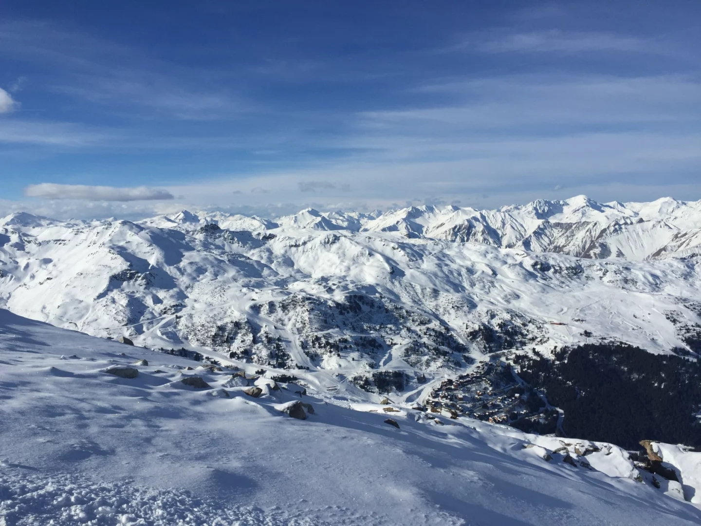 a snowy mountain range with blue sky