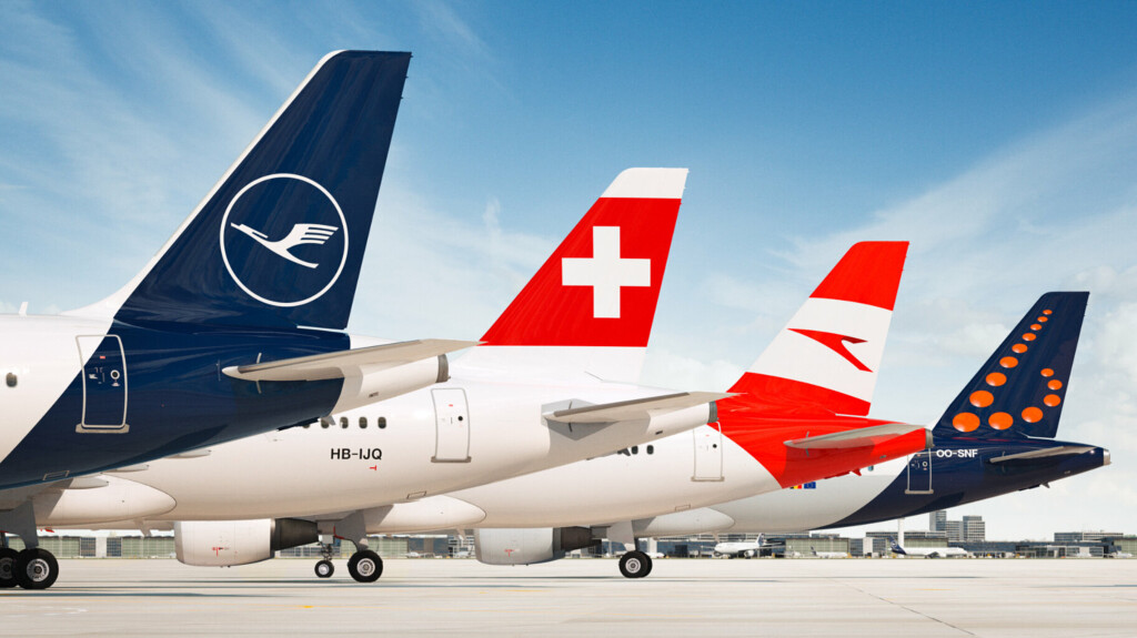a group of airplanes parked on a runway