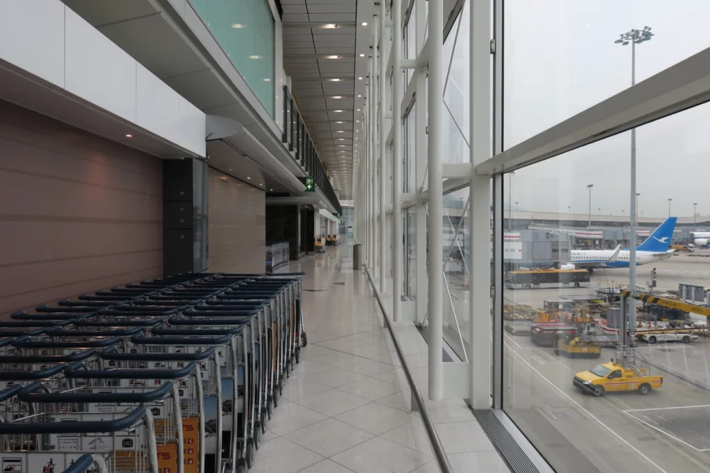 a row of luggage carts in a building