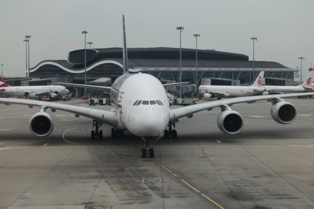 a large white airplane on a runway