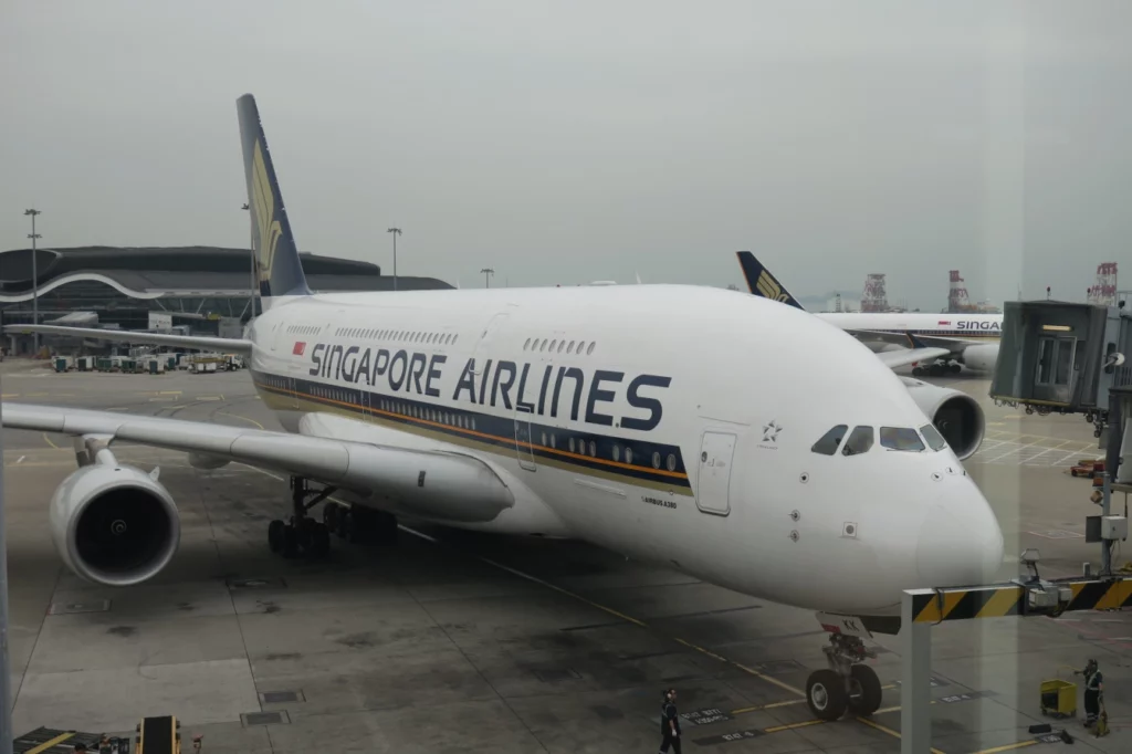 a large white airplane parked at an airport