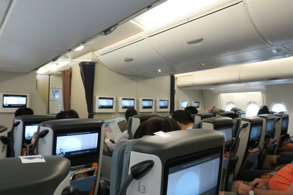 a group of people sitting on an airplane