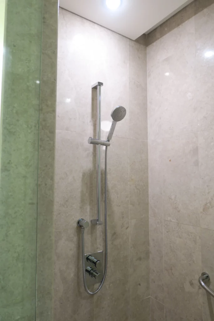 a shower head in a bathroom