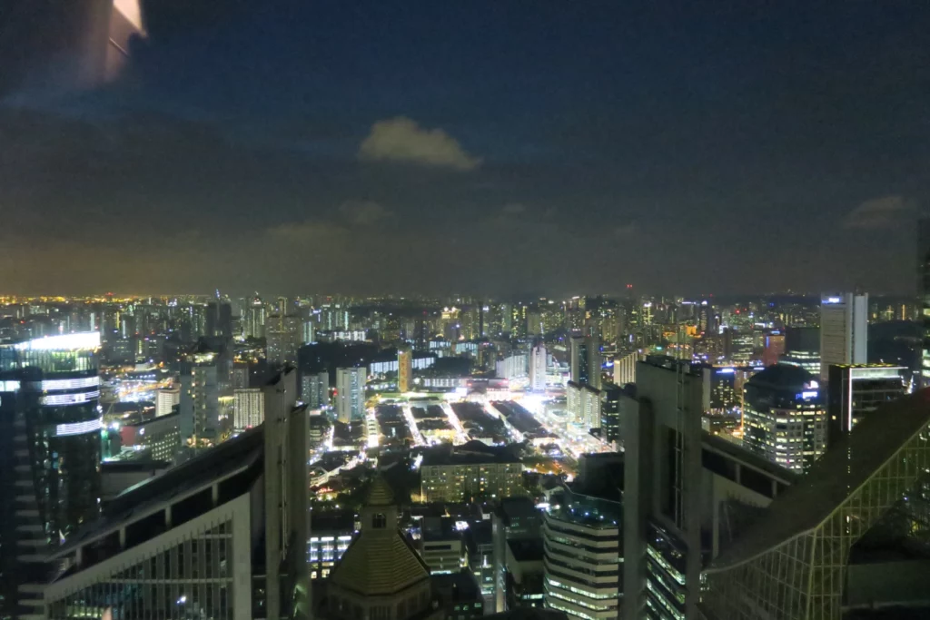 a city at night with many tall buildings