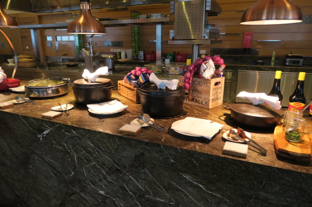 a kitchen with pots and pans on a counter