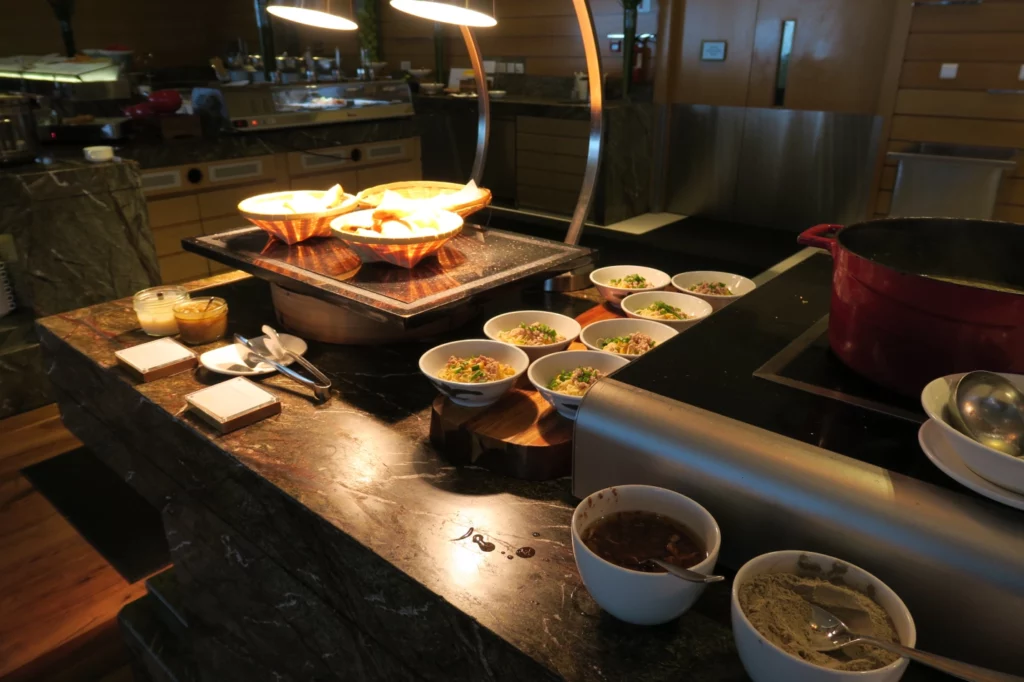 a counter with bowls of food on it