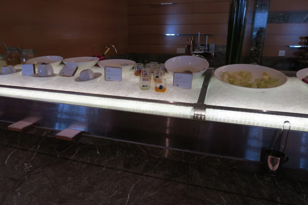 a buffet table with bowls of food