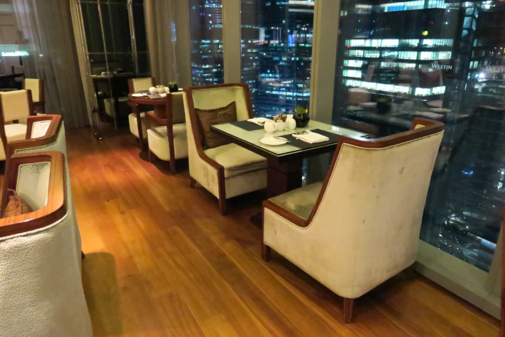 a restaurant with a view of the city