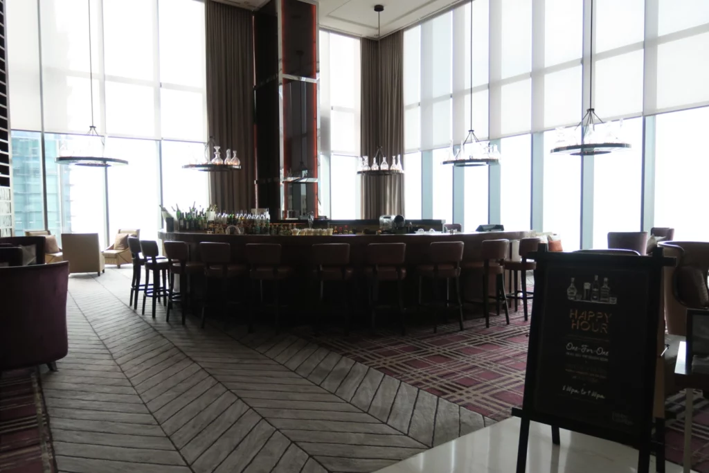 a large bar with a long table and chairs