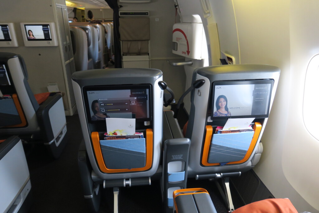 an airplane with seats and a screen