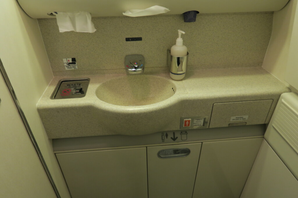 a sink and a bottle of soap on a counter