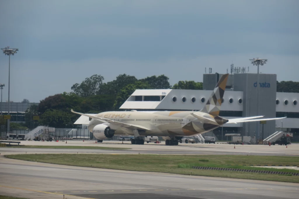 a large white airplane on a runway