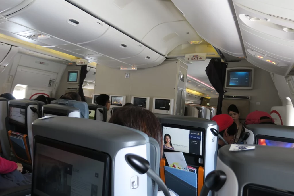 a group of people sitting in an airplane