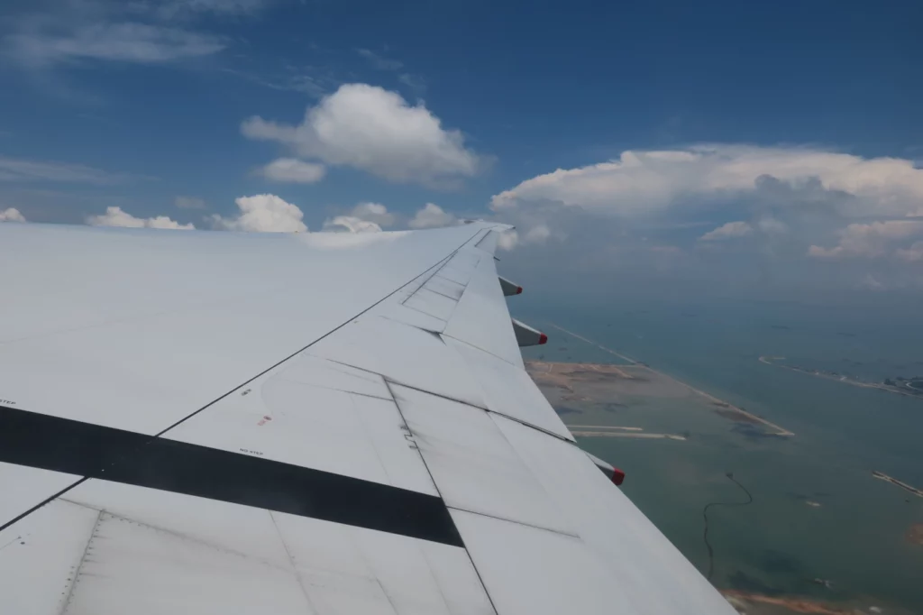 an airplane wing in the sky