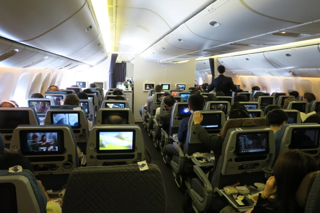 a group of people sitting in an airplane