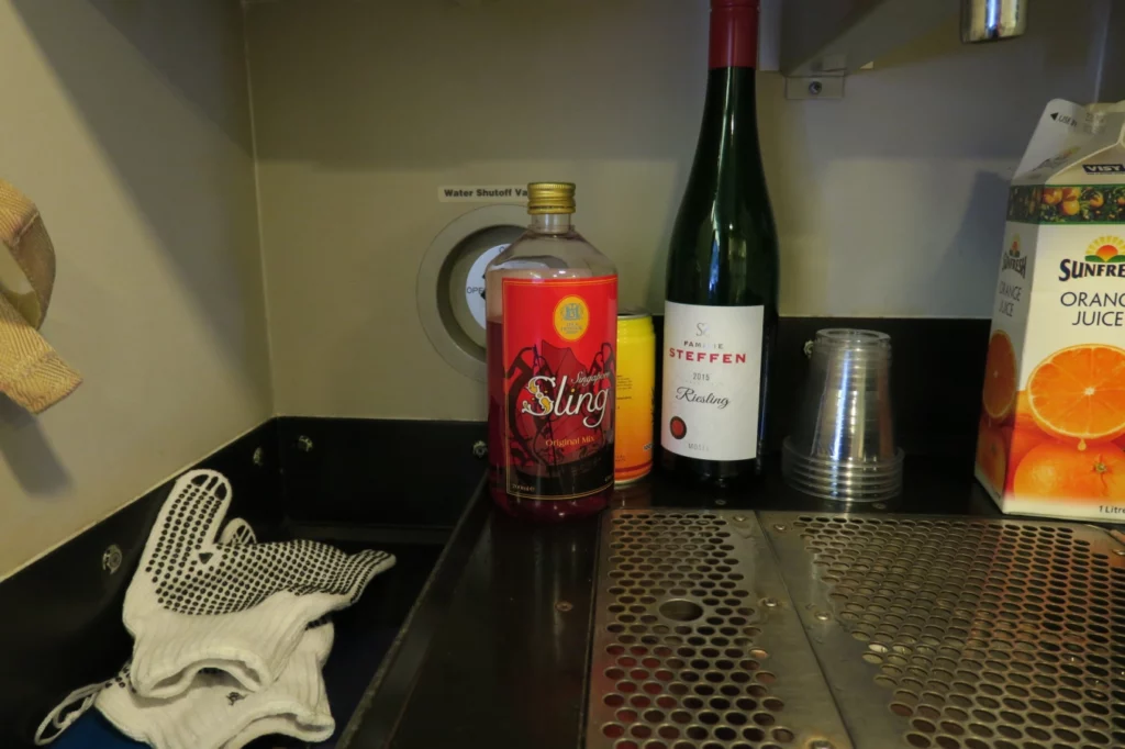 a bottle of wine and a glass on a counter