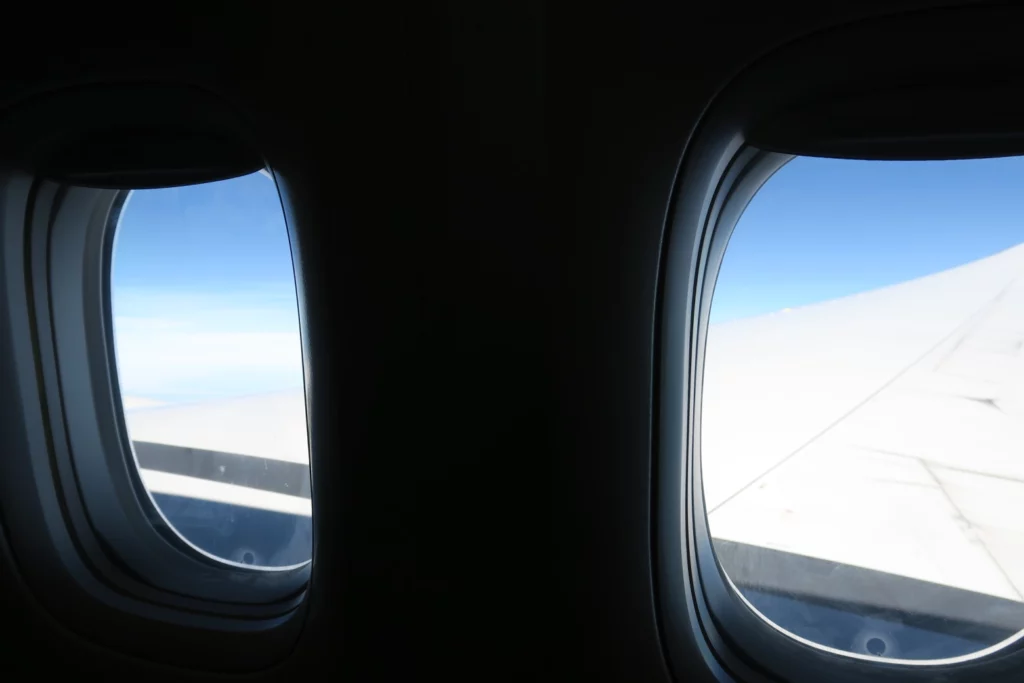 two windows with a view of the sky and clouds