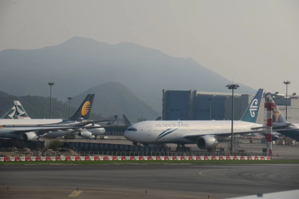 a group of airplanes on a runway