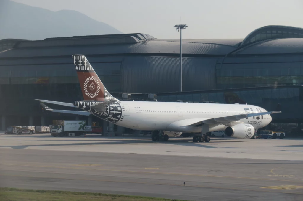 a white airplane on the runway