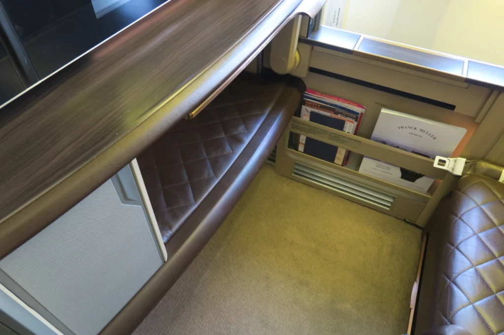 a desk with a tv and books in it