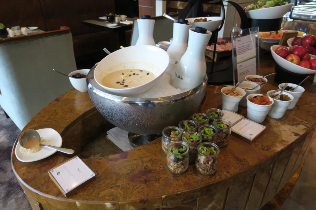 a bowl of soup and other food on a table