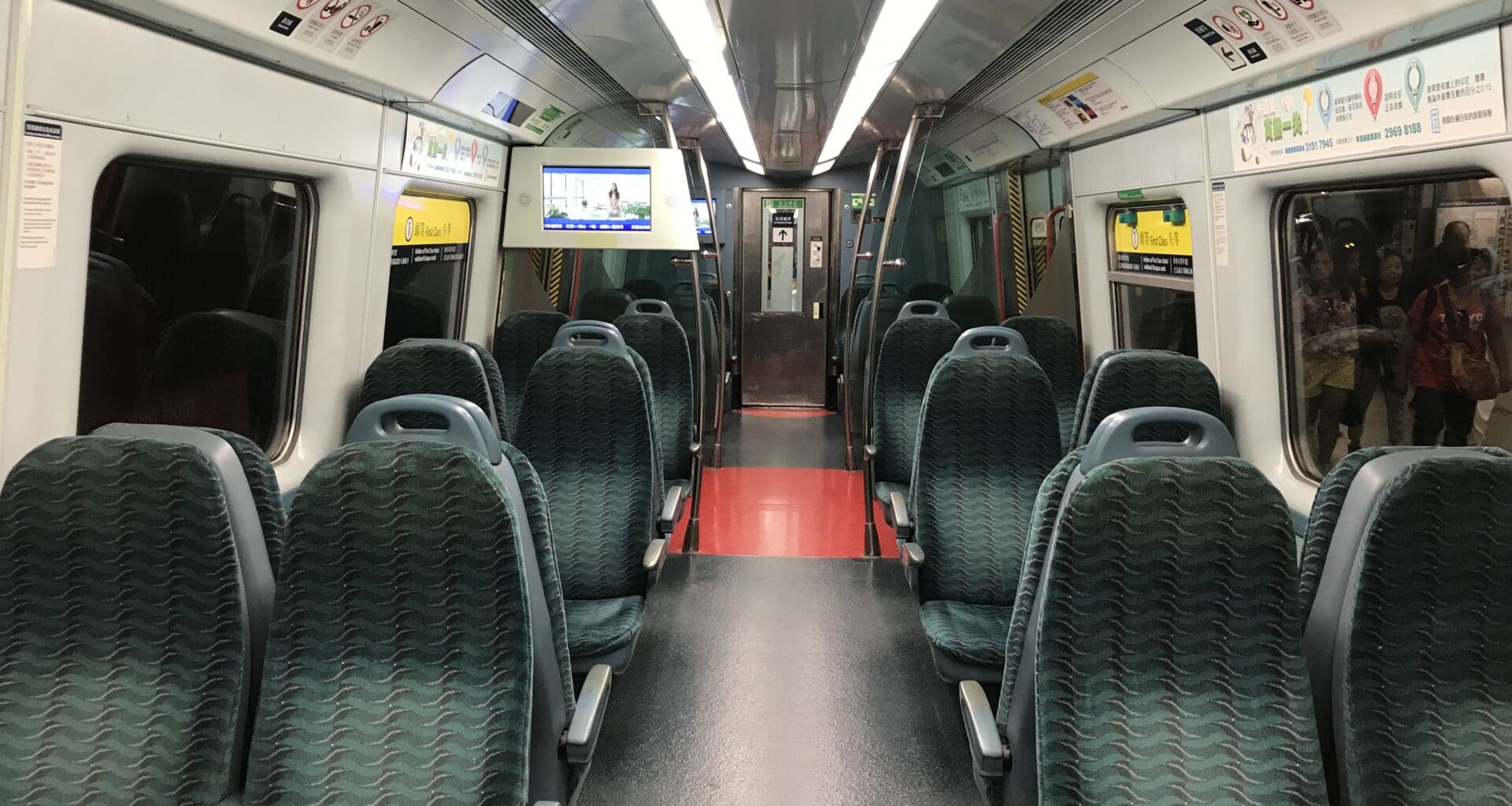 a train with seats and a television