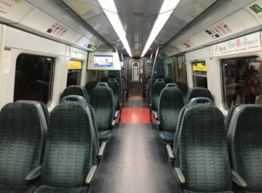 a train with seats and a television