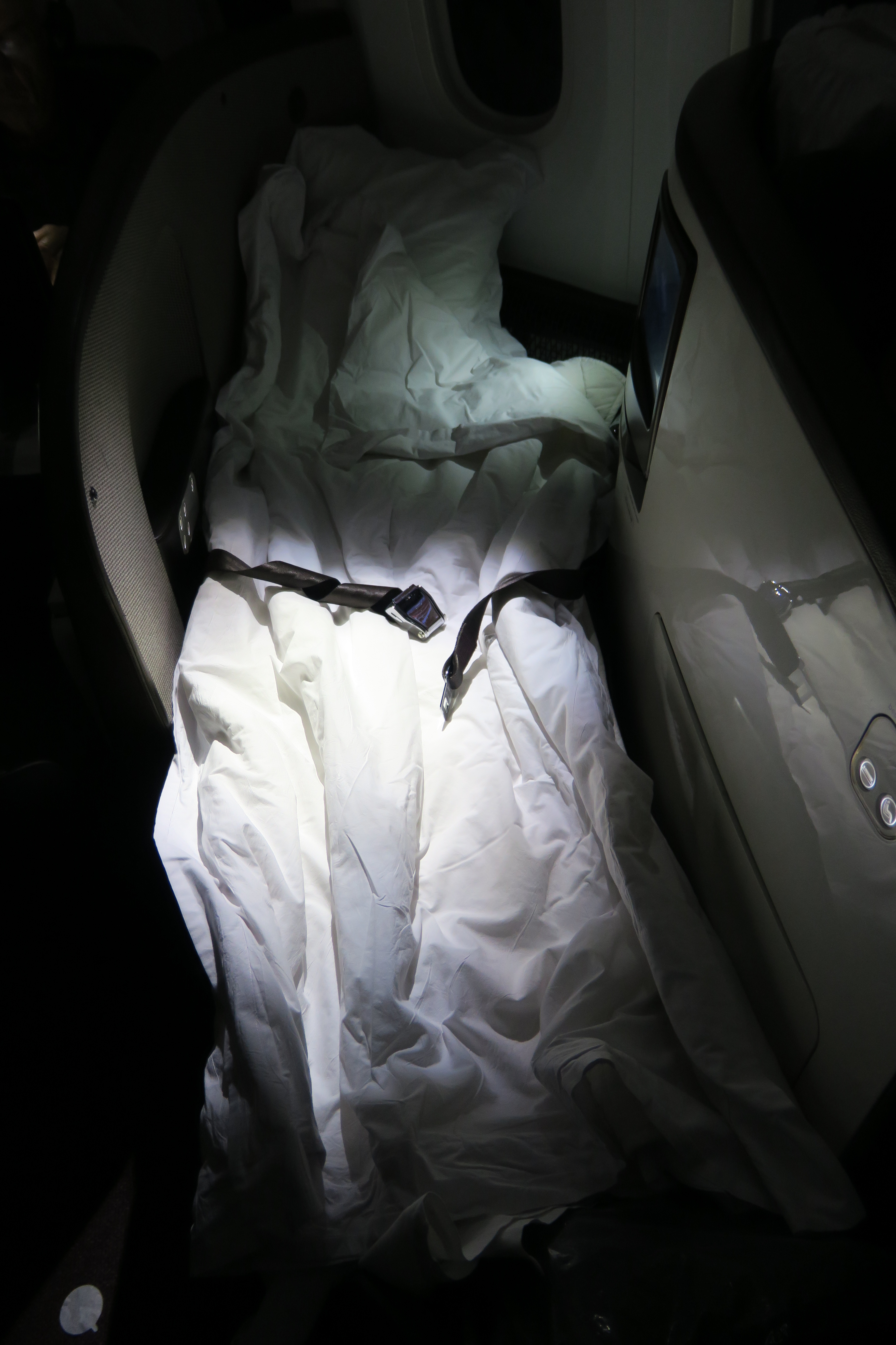 a seat belt on a bed